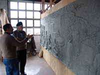 Designer and sculptor with scale model of the monument