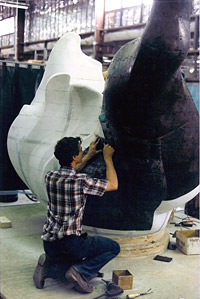 Metalworker with model for the flame for the Statue of Liberty, 1985